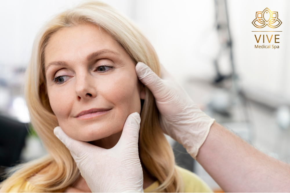 Mature woman receiving a professional facial assessment at Vive Medical Spa, experts in rejuvenating treatments in Tijuana.